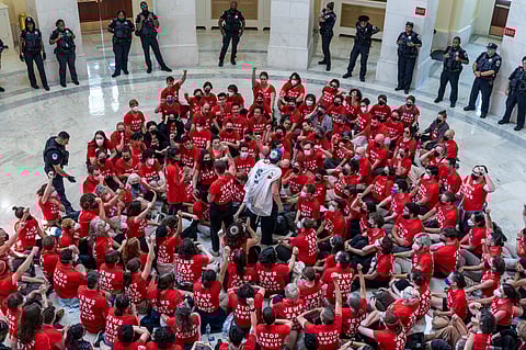 Demonstrators protest against the military policies of Israel a day before a visit by Israeli Prime Minister Netanyahu who will address a joint meeting of Congress on Wednesday, in the Cannon House Office Building at the Capitol in Washington, Tuesday, July 23, 2024
